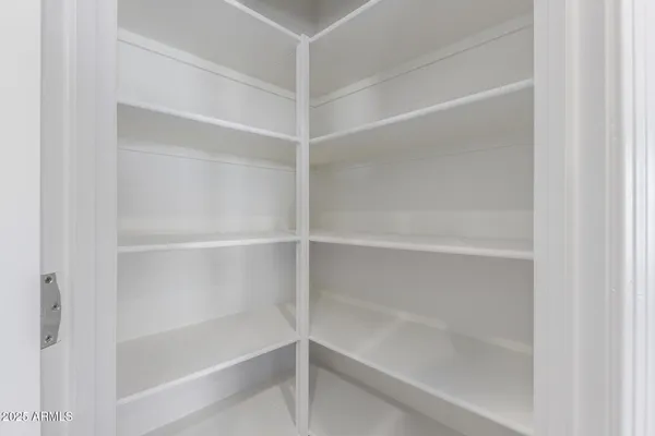 a kitchen with kitchen island a sink appliances and cabinets