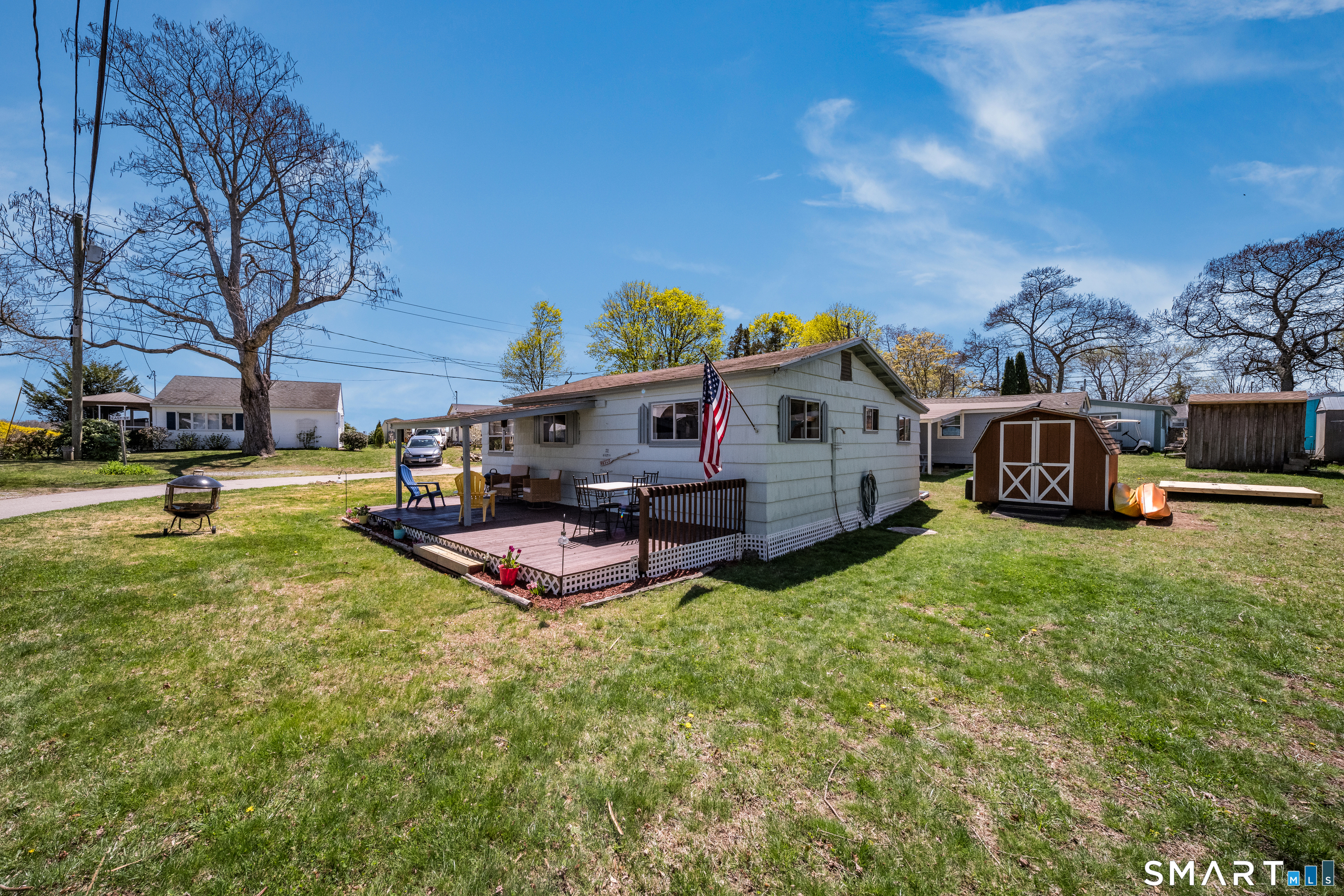 32 North Street Madison, CT 06443 - Photo 4 of 20 Backyard equip with a storage shed and outdoor shower!
