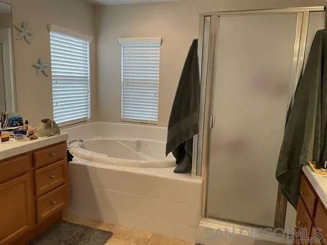 a bathroom with a bathtub and a sink