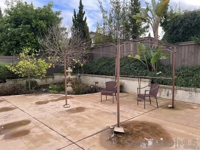 a view of a backyard with a bench