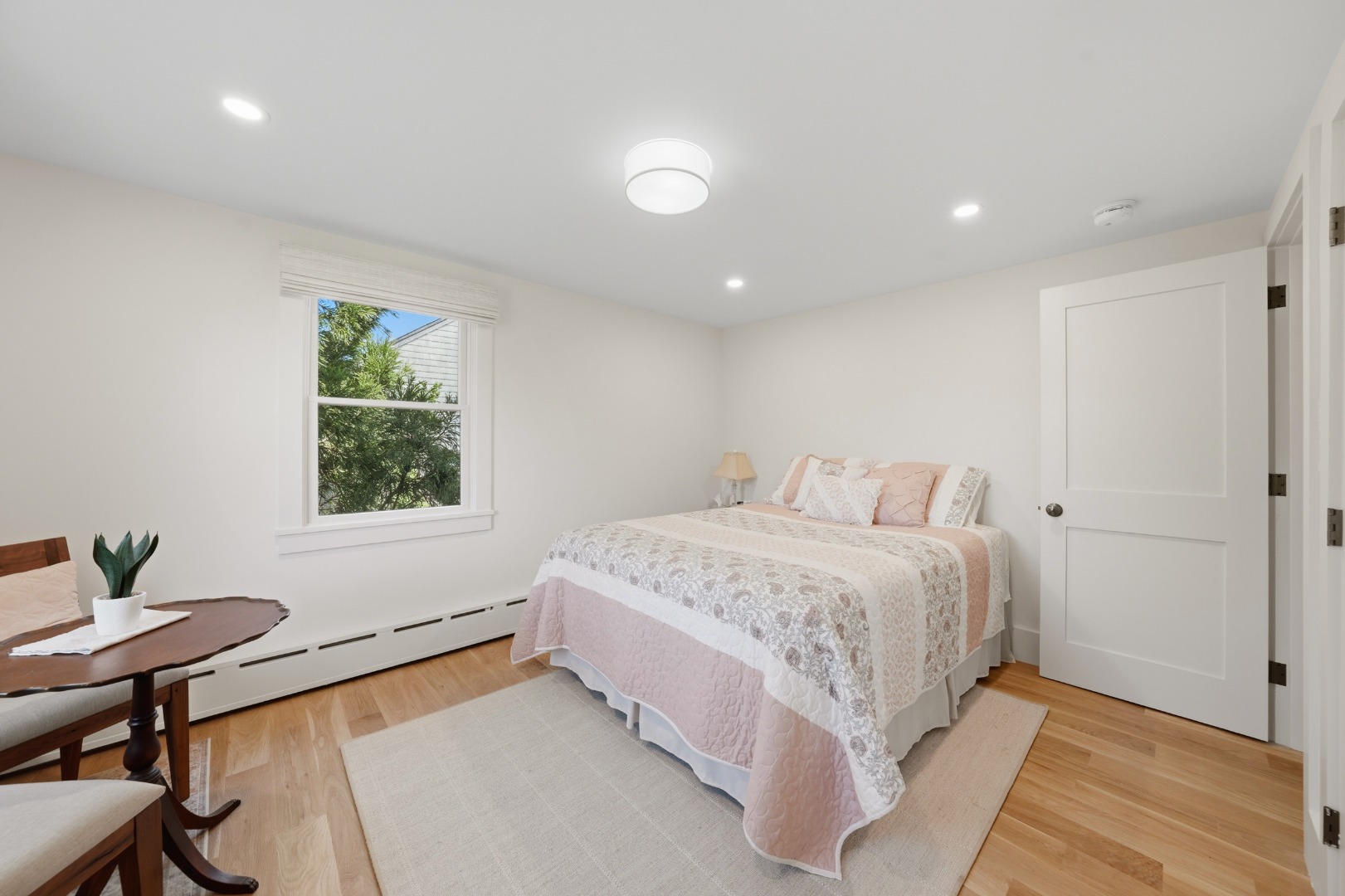 3 Newtown Road Nantucket, MA 02554 - Photo 9 of 20 a spacious bedroom with a bed and a window