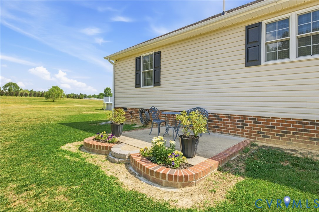15300 Lebanon Road Spring Grove, VA 23881 - Photo 39 of 41 Side patio as you enter the driveway showing very