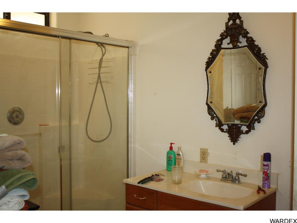 44411 East Perry Lane Salome, AZ 85348 - Photo 8 of 26 a bathroom with a sink vanity and mirror