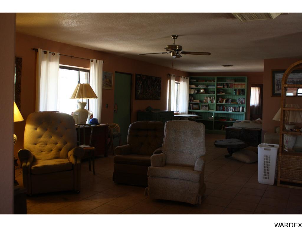 44411 East Perry Lane Salome, AZ 85348 - Photo 9 of 26 a living room with furniture and a large window