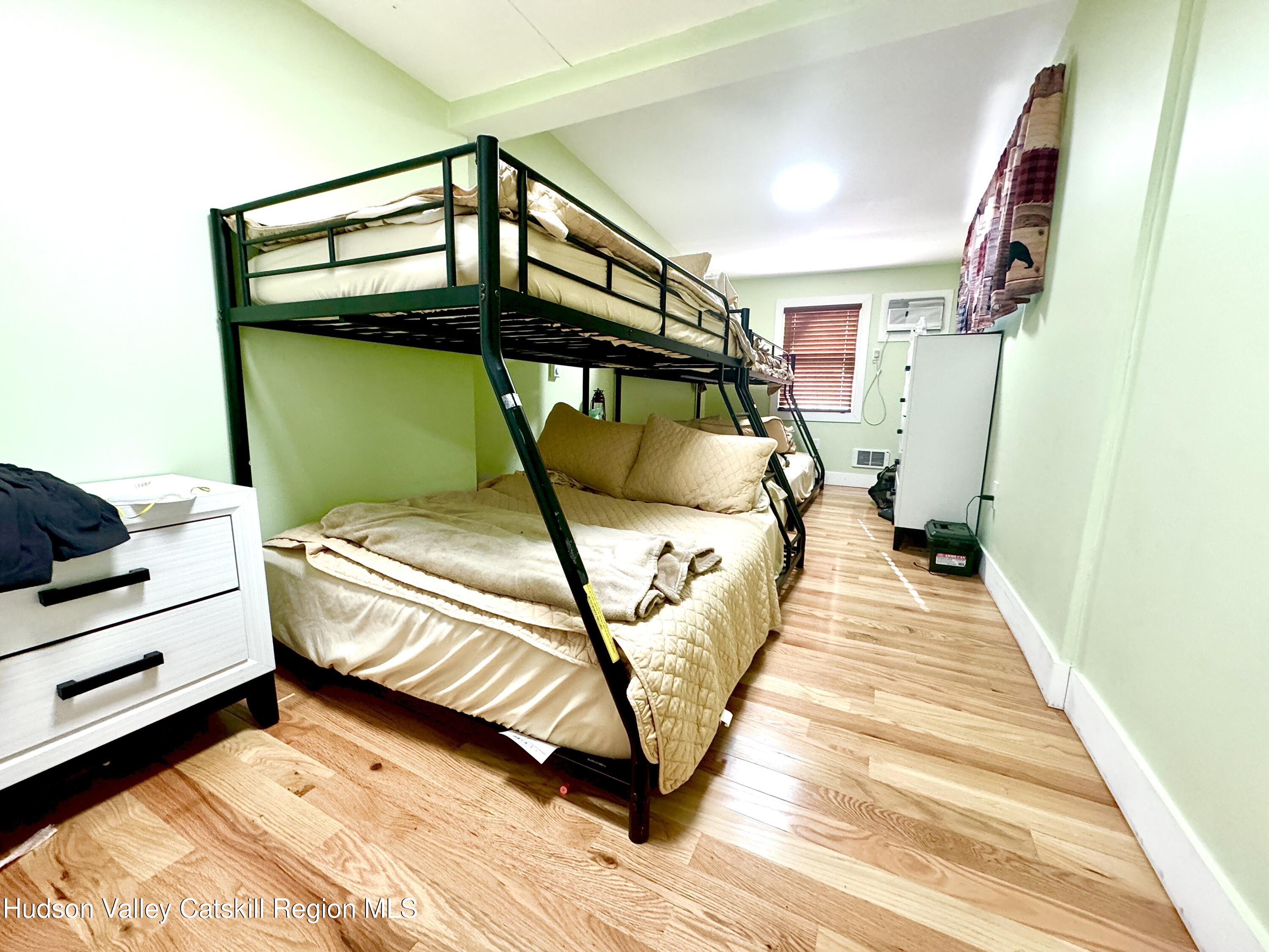 50 Harris Road Kerhonkson, NY 12446 - Photo 12 of 28 a bed room with a bed and a window