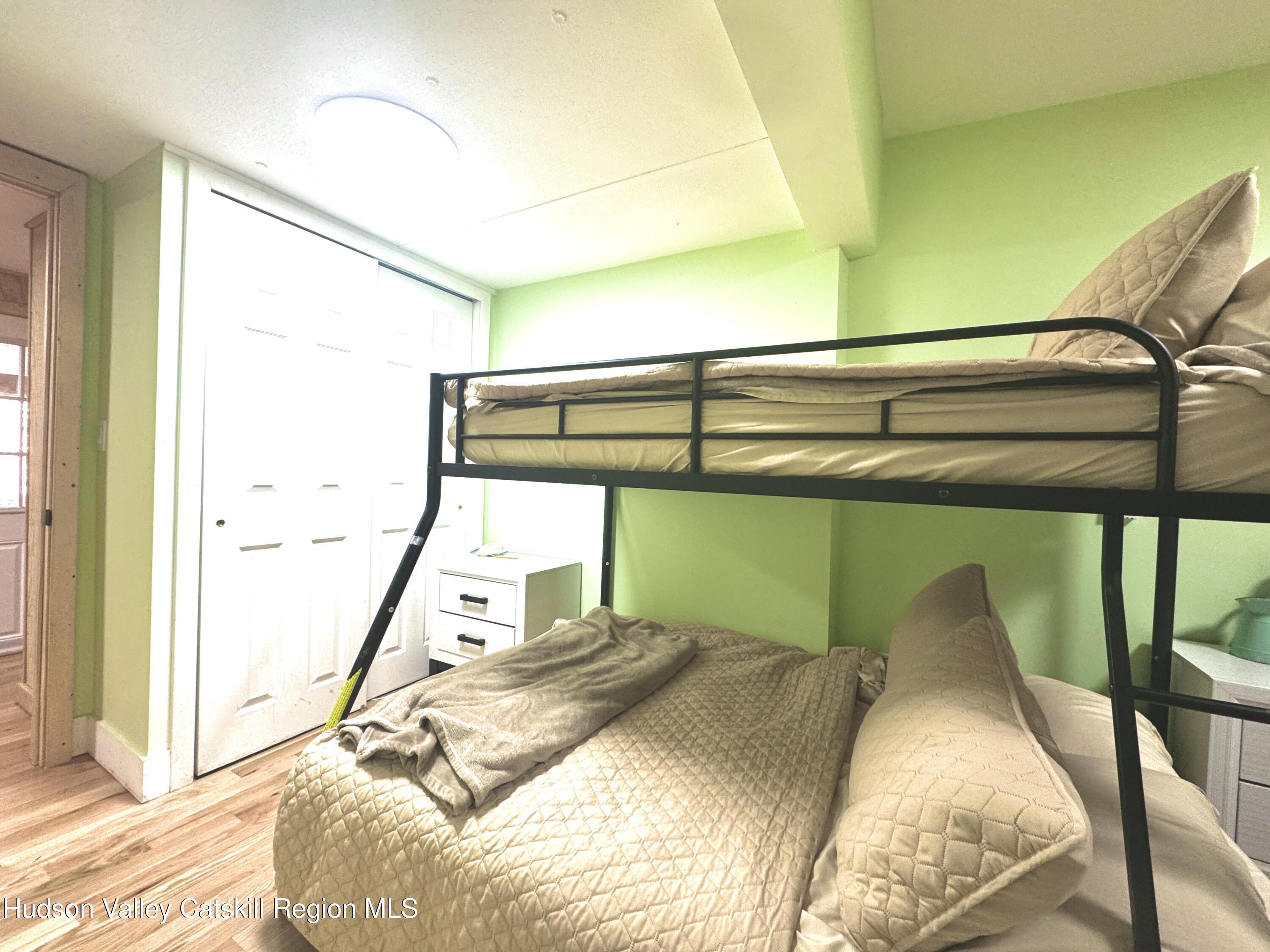 50 Harris Road Kerhonkson, NY 12446 - Photo 13 of 28 a bedroom with a bed and a window