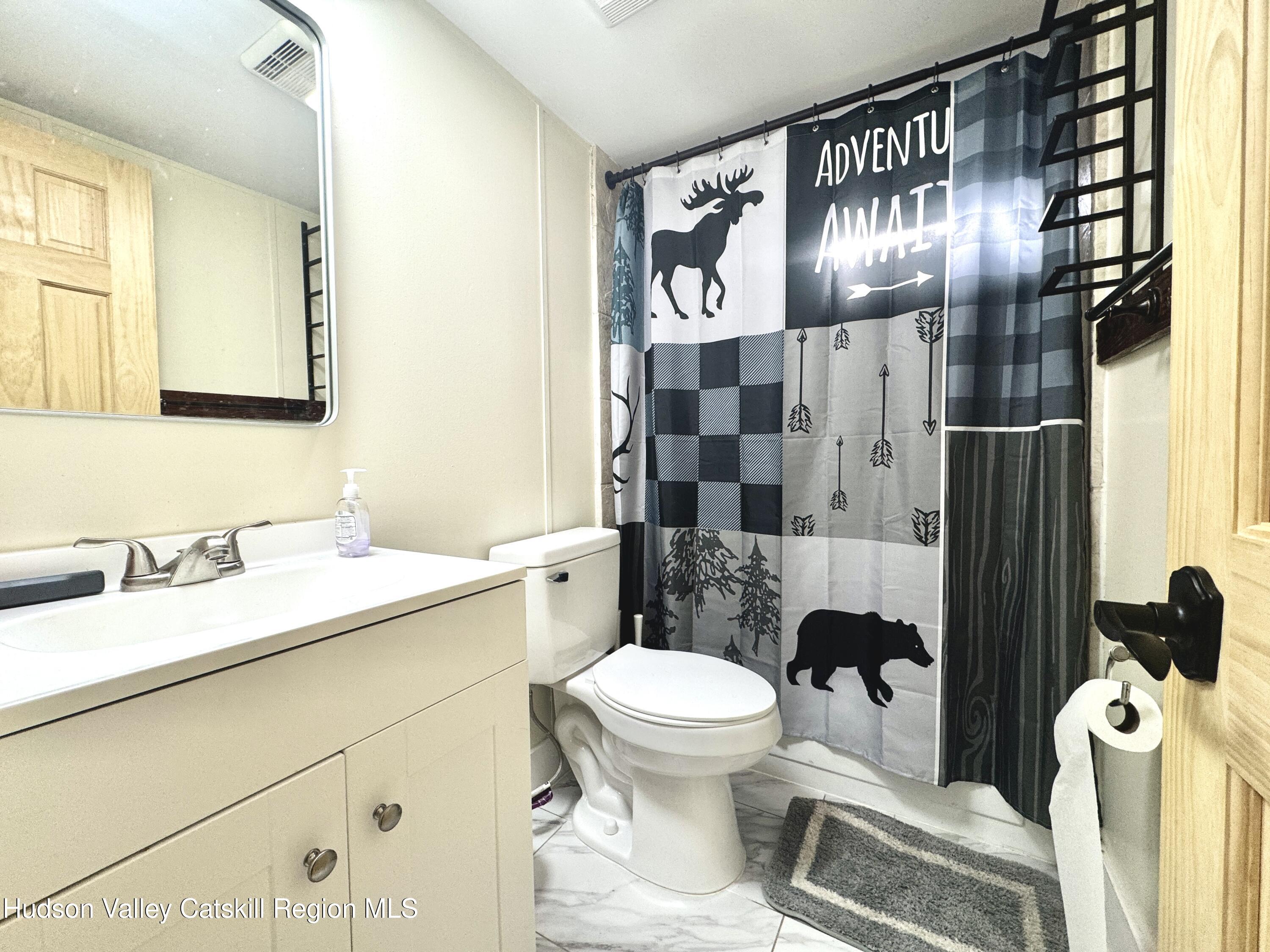 50 Harris Road Kerhonkson, NY 12446 - Photo 14 of 28 a bathroom with a sink toilet and shower
