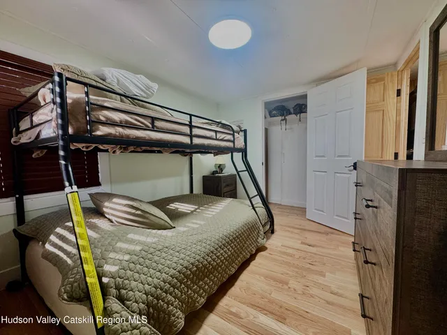 a view of a livingroom with furniture and hardwood floor