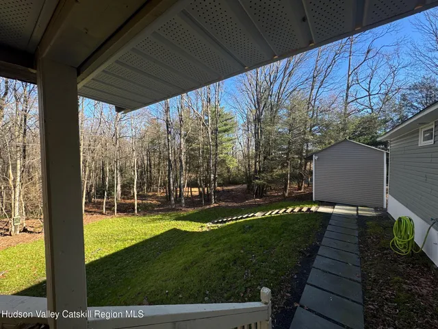a view of a park with large trees