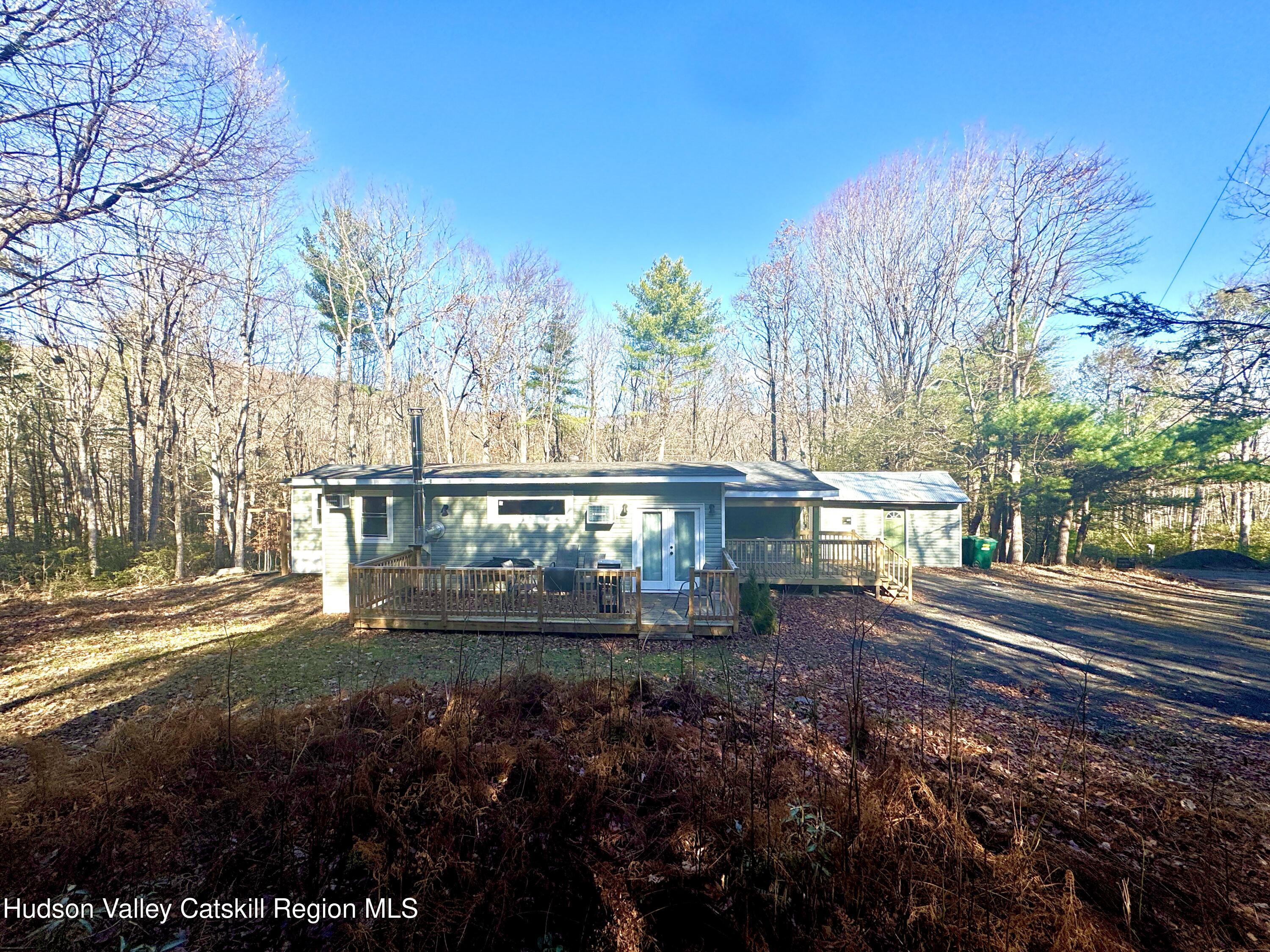 50 Harris Road Kerhonkson, NY 12446 - Photo 2 of 28 a front view of a house with a yard