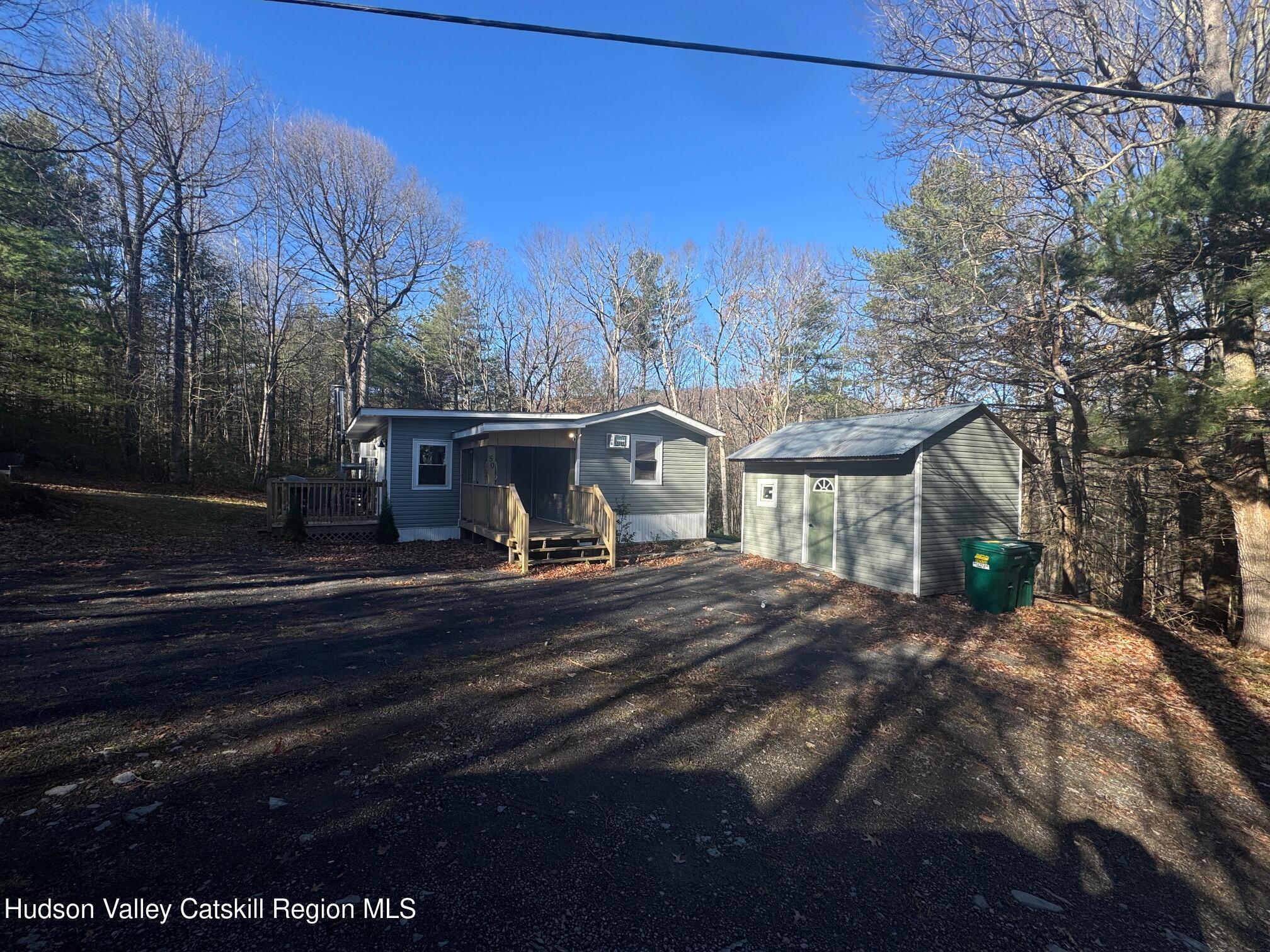 50 Harris Road Kerhonkson, NY 12446 - Photo 26 of 28 a view of house with outdoor space and garden