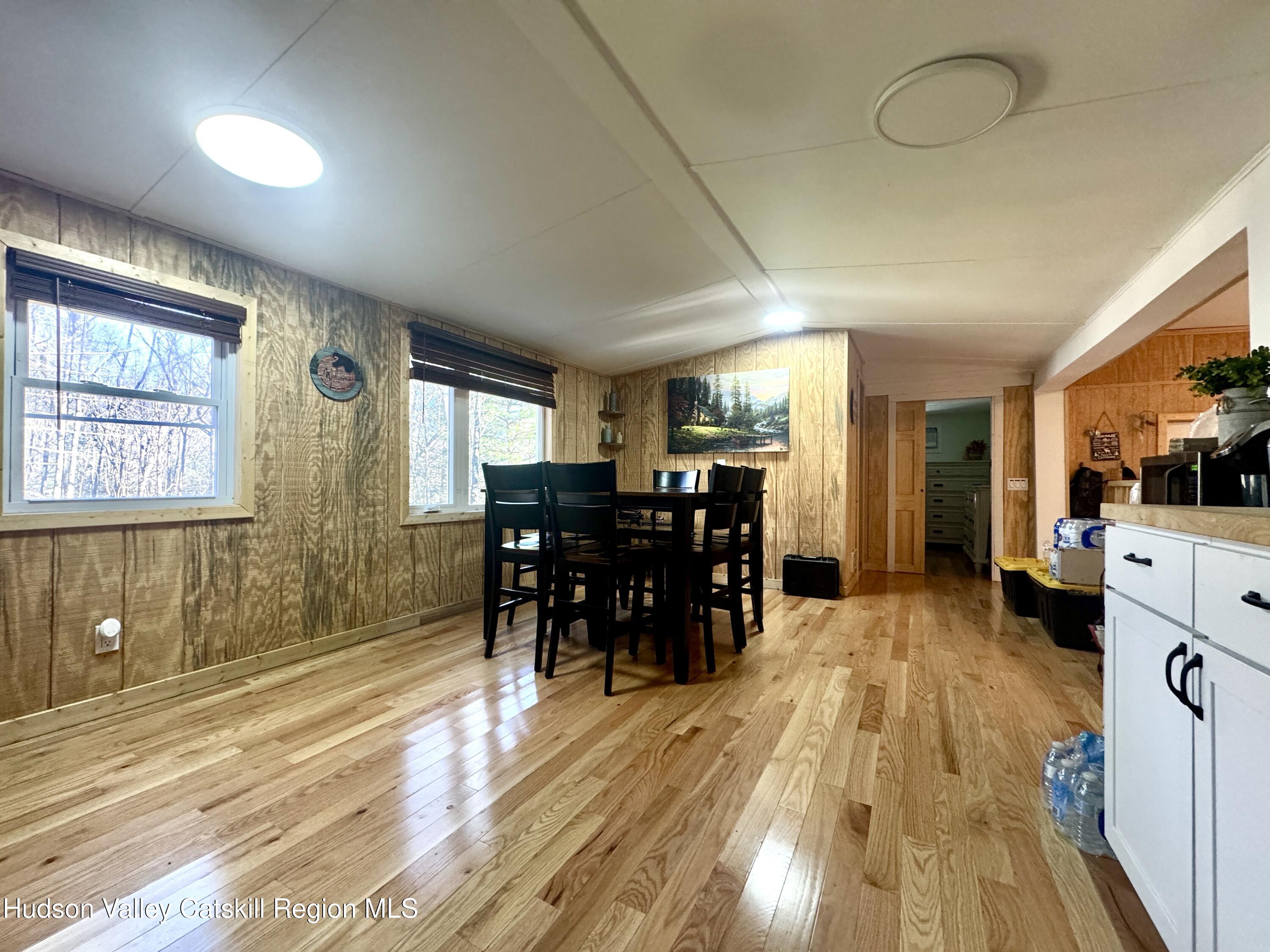 50 Harris Road Kerhonkson, NY 12446 - Photo 4 of 28 a view of a dining room with furniture window and wooden floor