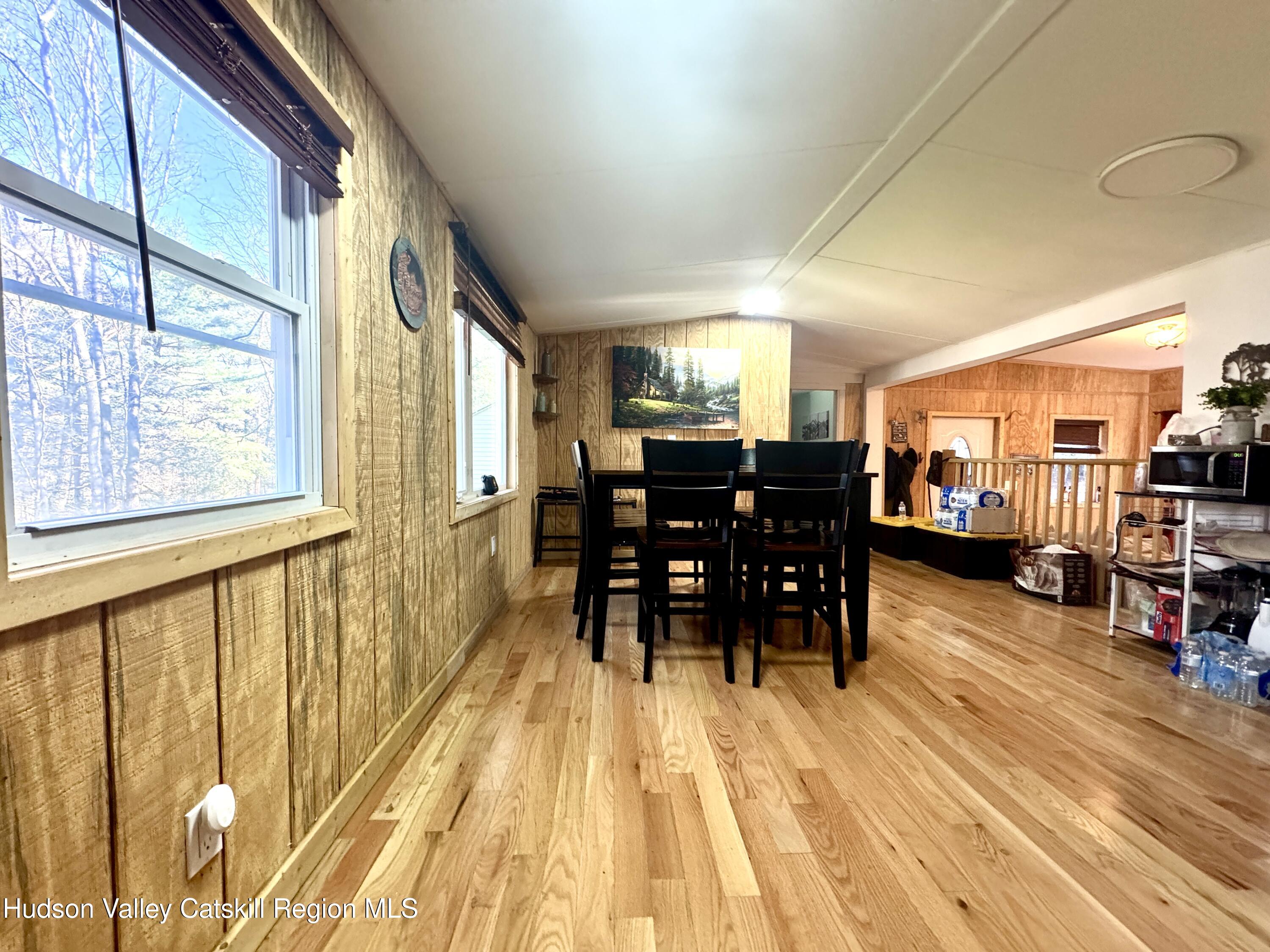 50 Harris Road Kerhonkson, NY 12446 - Photo 5 of 28 a dining room with furniture and wooden floor