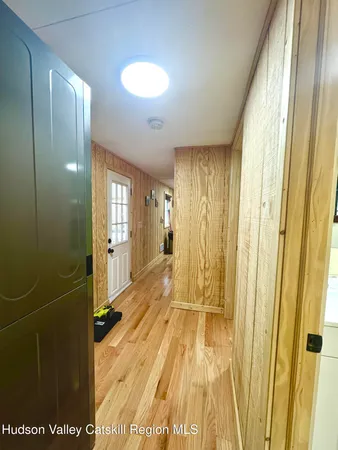 a view of a living room with washer and dryer