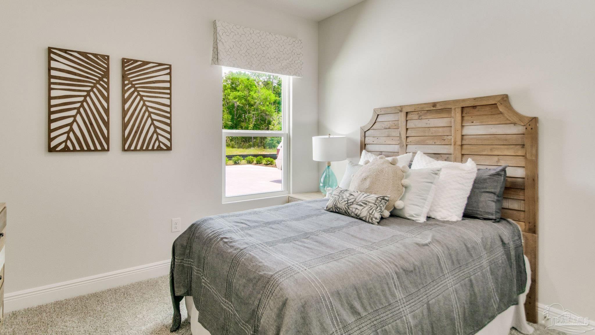 108 Albatross Street Cantonment, FL 32533 - Photo 32 of 35 a bedroom with a bed and a window