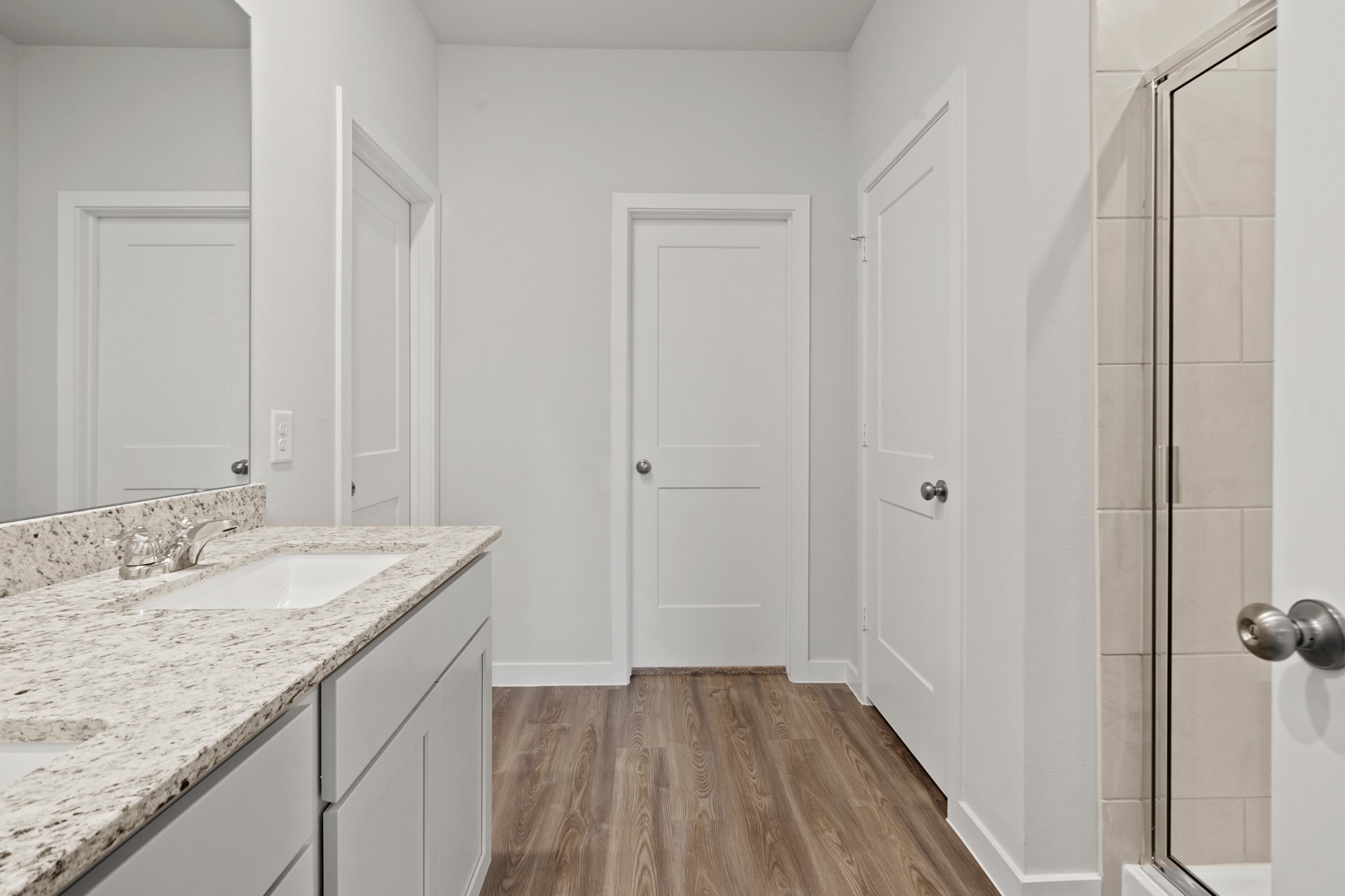 527 Shoreview Drive Conroe, TX 77303 - Photo 14 of 27 a bathroom with a granite countertop sink and a mirror