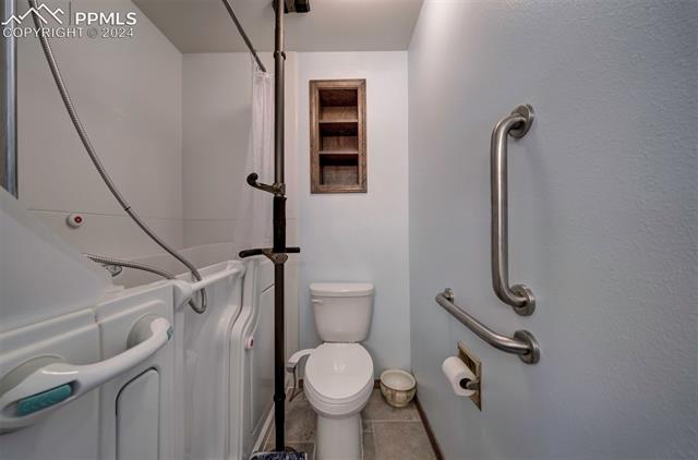 18255 Stoneview Road Monument, CO 80132 - Photo 37 of 42 Bathroom with walk in tub / shower