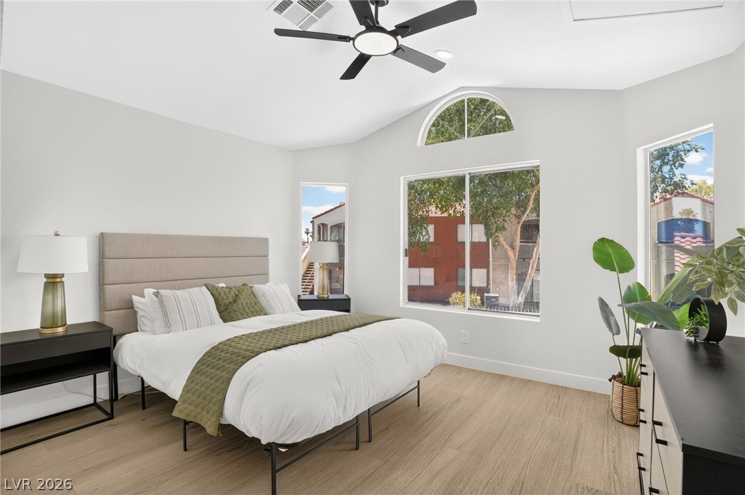 2681 Rungsted Street Las Vegas, NV 89142 - Photo 4 of 33 Natural light floods this inviting bedroom through large windows and an arched transom.