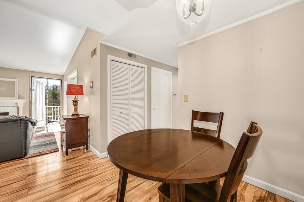 4 Walden Drive, Unit 19 Natick, MA 01760 - Photo 11 of 42 a view of a dining room with furniture and wooden floor
