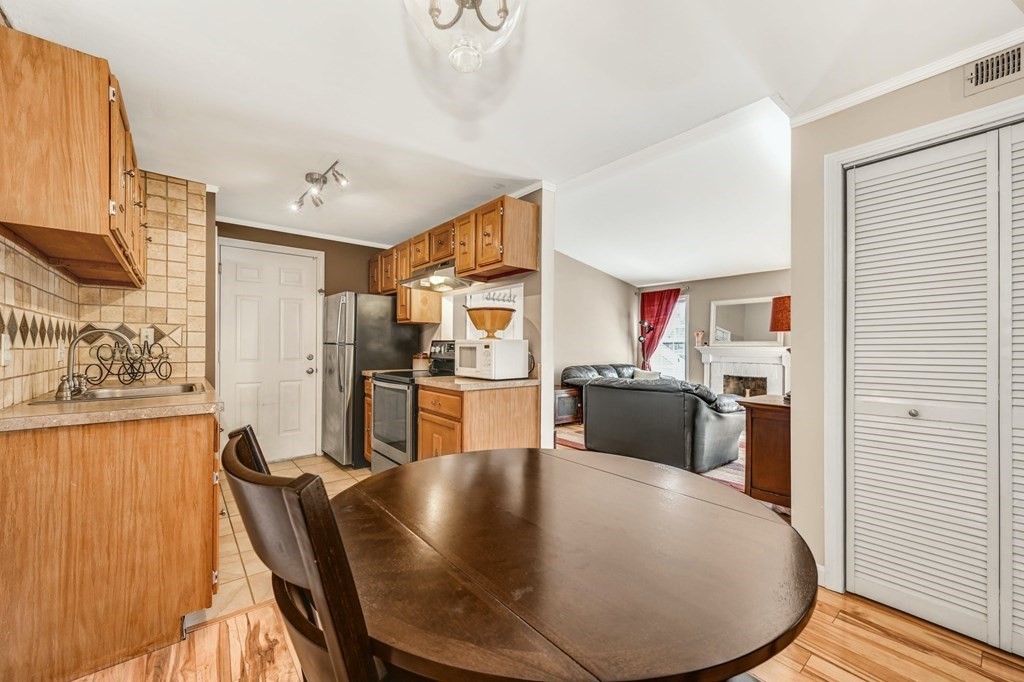 4 Walden Drive, Unit 19 Natick, MA 01760 - Photo 12 of 42 a view of a dining room with furniture and wooden floor