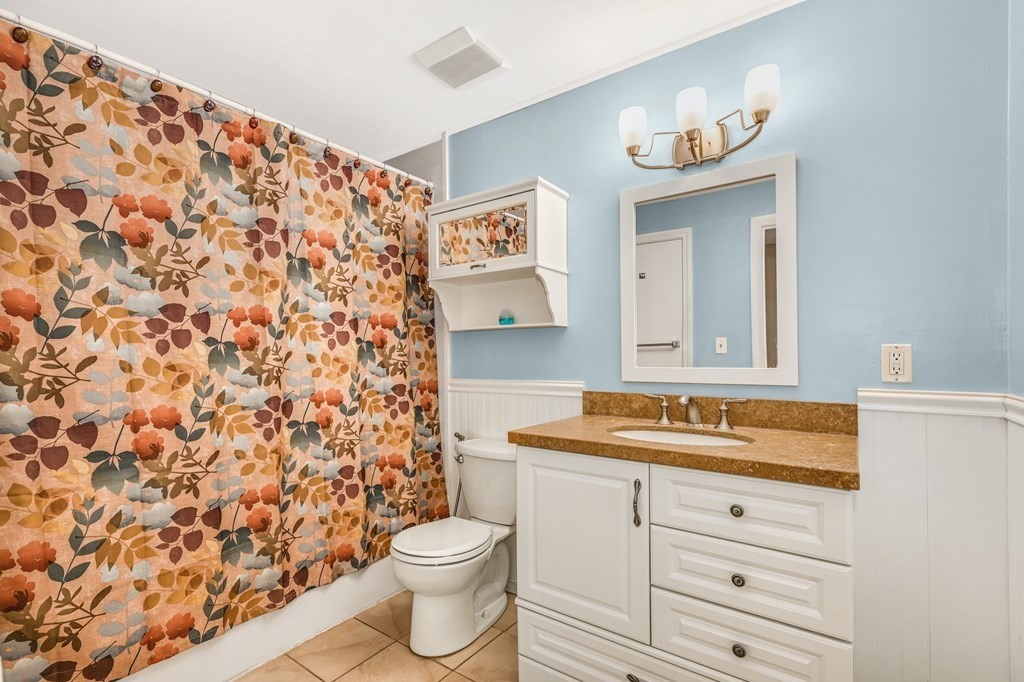 4 Walden Drive, Unit 19 Natick, MA 01760 - Photo 19 of 42 a bathroom with a sink toilet and shower