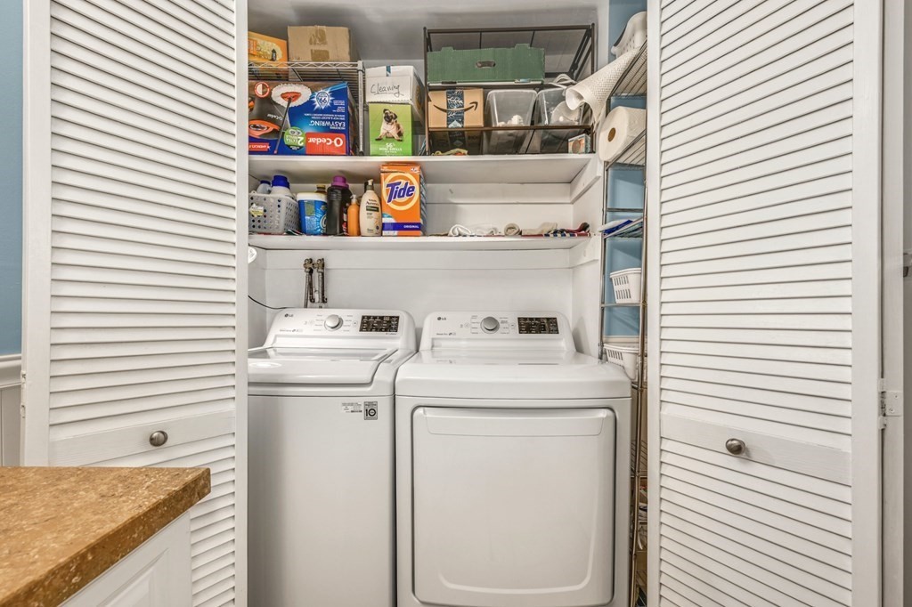 4 Walden Drive, Unit 19 Natick, MA 01760 - Photo 20 of 42 a utility room with dryer and washer