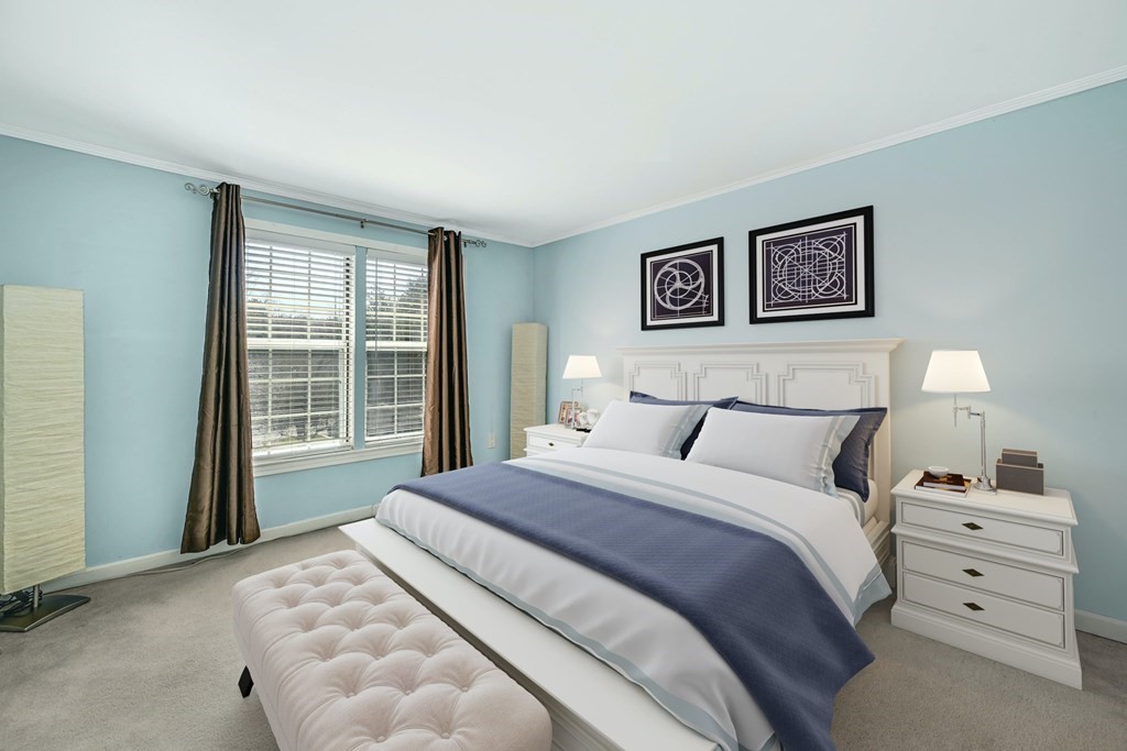 4 Walden Drive, Unit 19 Natick, MA 01760 - Photo 21 of 42 a bedroom with a bed and a window