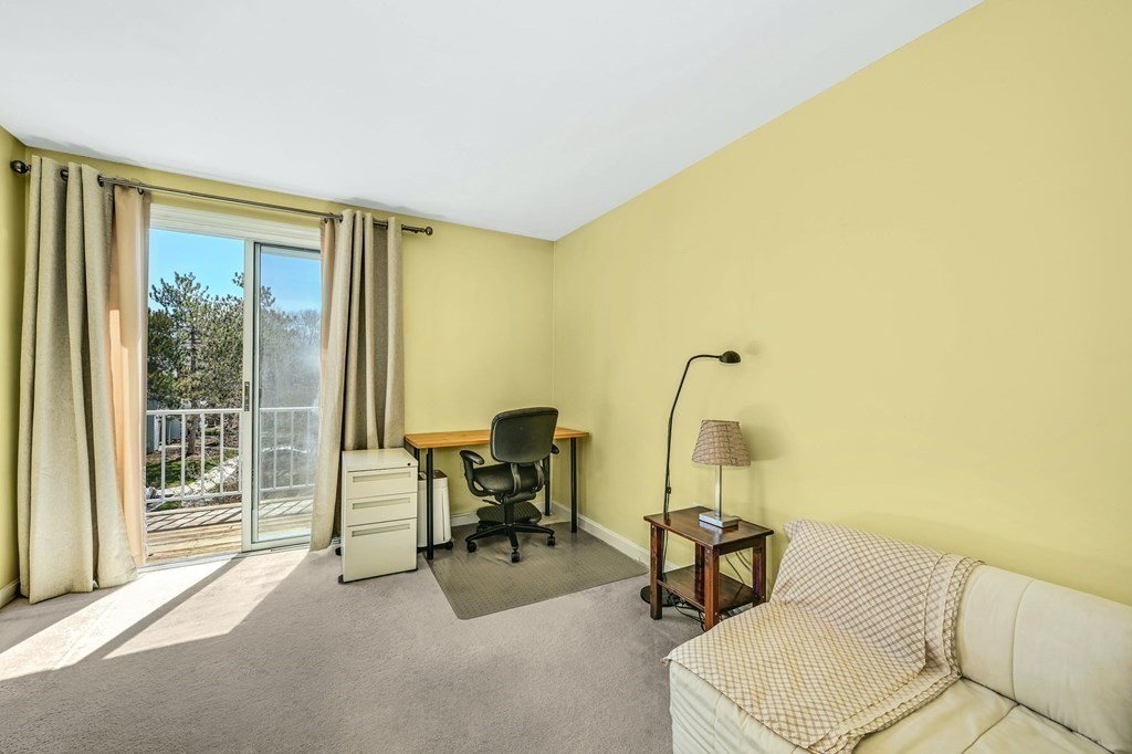 4 Walden Drive, Unit 19 Natick, MA 01760 - Photo 28 of 42 a bedroom with furniture and a window