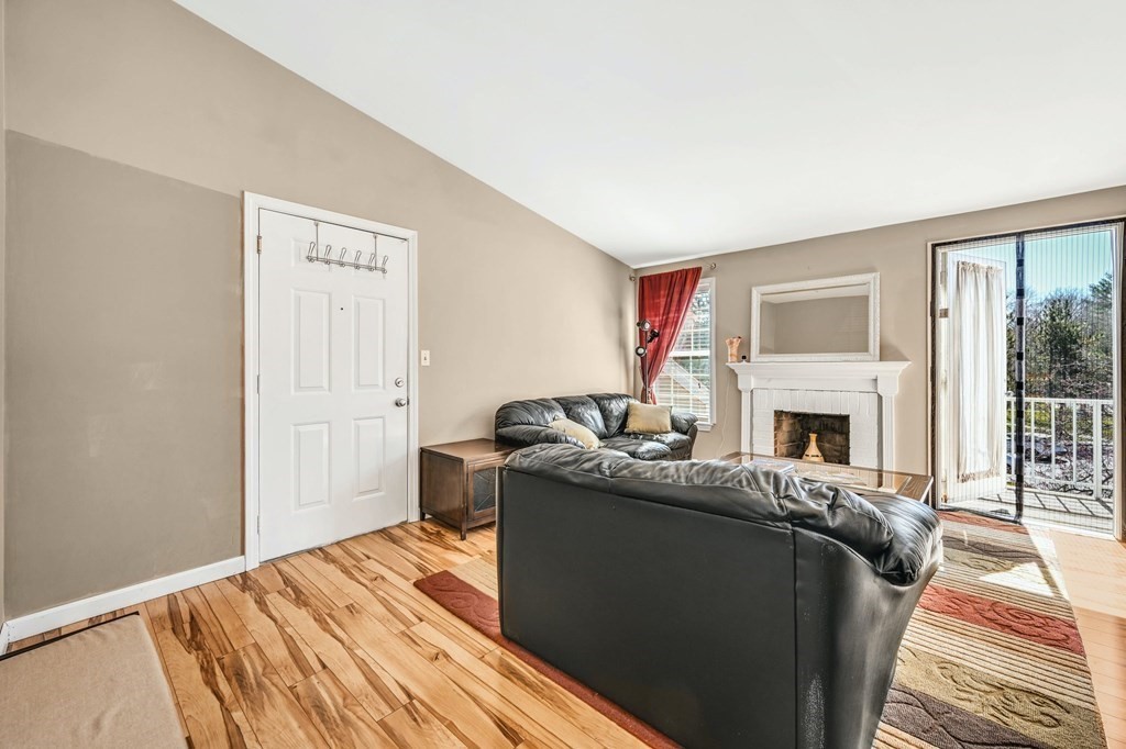 4 Walden Drive, Unit 19 Natick, MA 01760 - Photo 6 of 42 a bed room with a bed and a fireplace