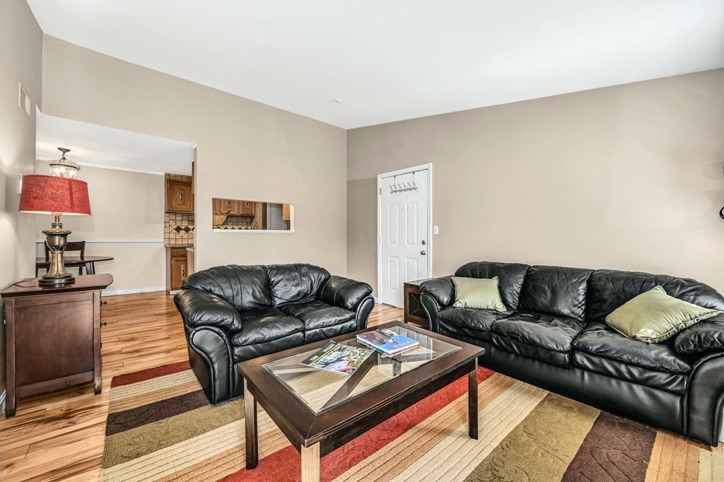 4 Walden Drive, Unit 19 Natick, MA 01760 - Photo 8 of 42 a living room with furniture and a couch