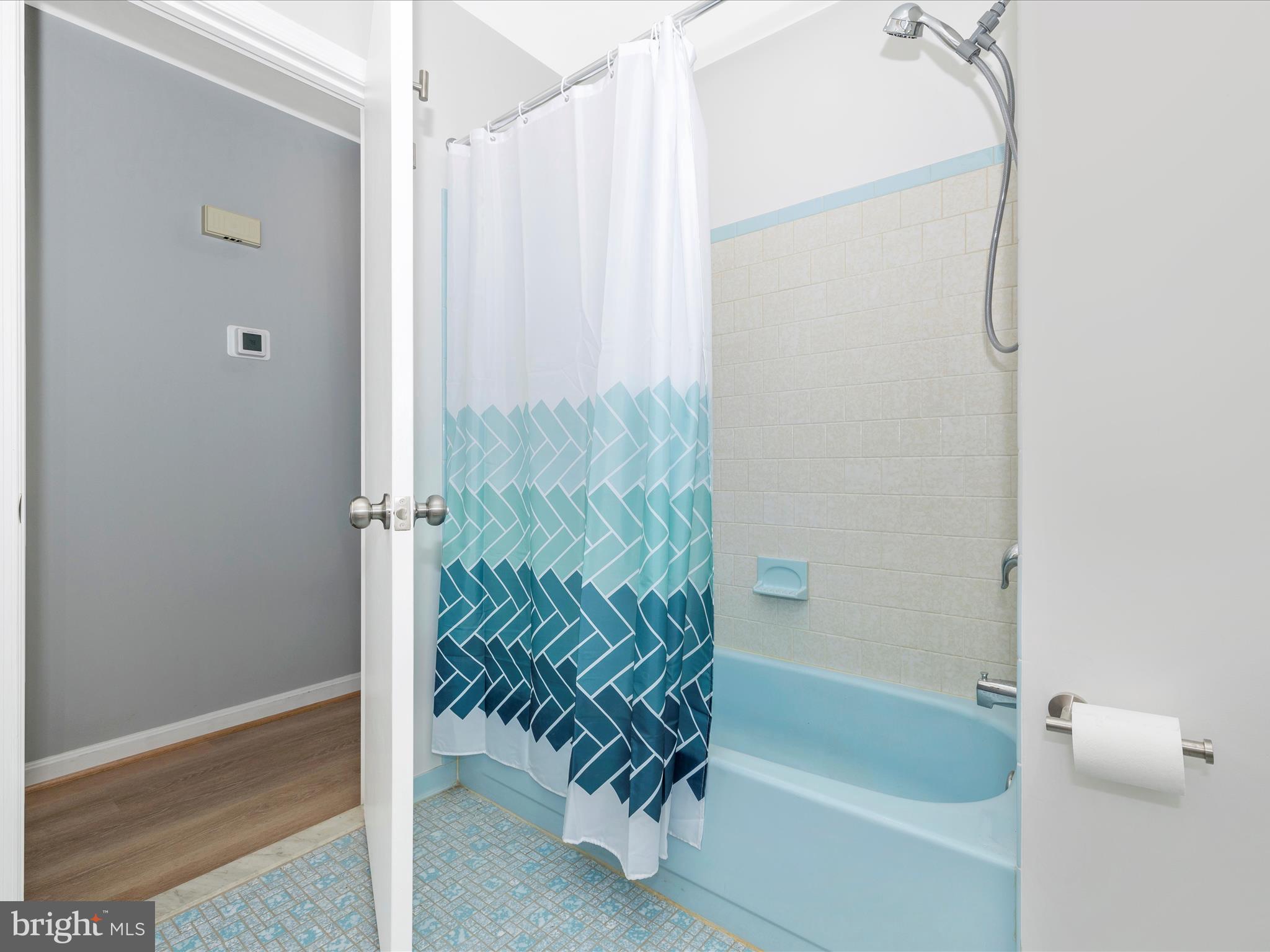 5154 Perry Road Mount Airy, MD 21771 - Photo 29 of 53 a bathroom with a bathtub and a shower