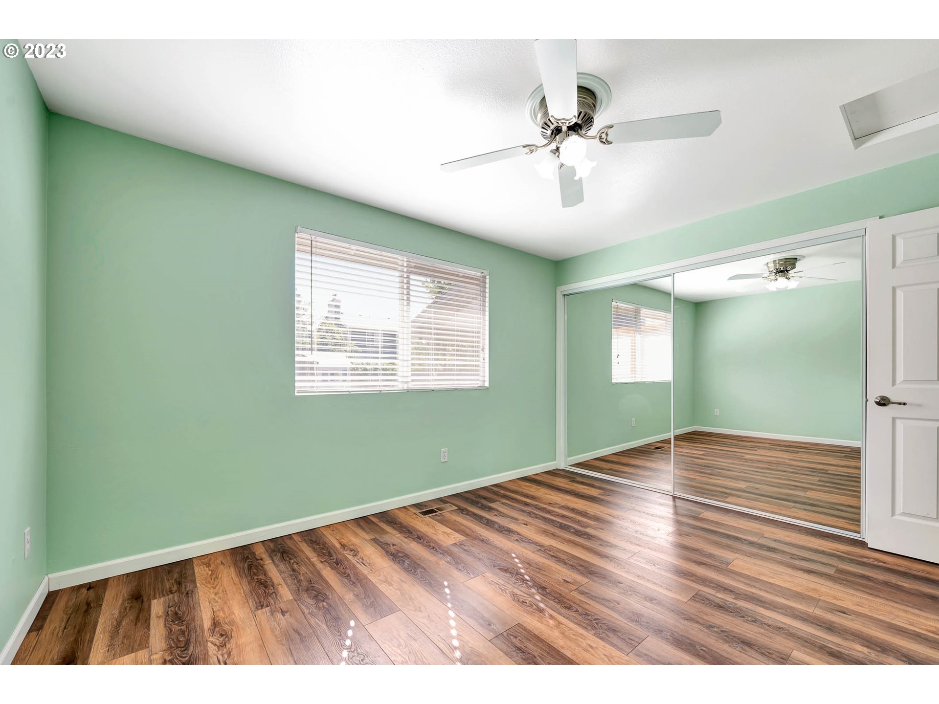 849 South 44th Street Springfield, OR 97478 - Photo 27 of 41 a view of an empty room with wooden floor and a window