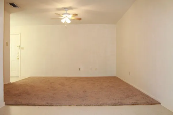a view of a room with an empty space
