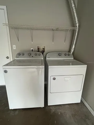 a utility room with dryer and washer