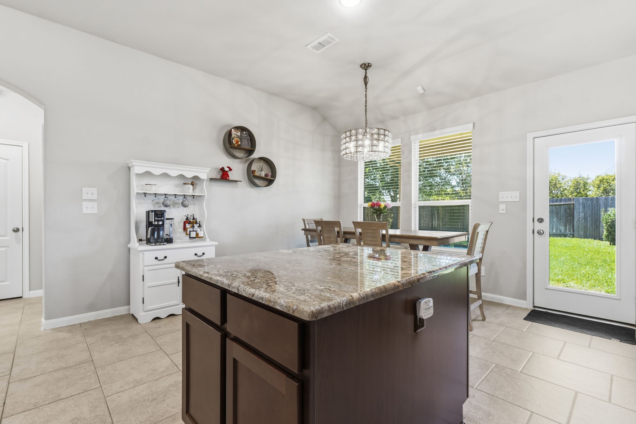 3900 Enchanted Timbers Lane Spring, TX 77386 - Photo 16 of 49 a kitchen with a sink a counter space and a view of dining room