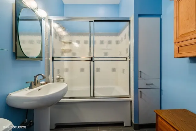 a bathroom with a sink and a mirror