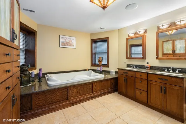 a spacious bathroom with a granite countertop sink and a