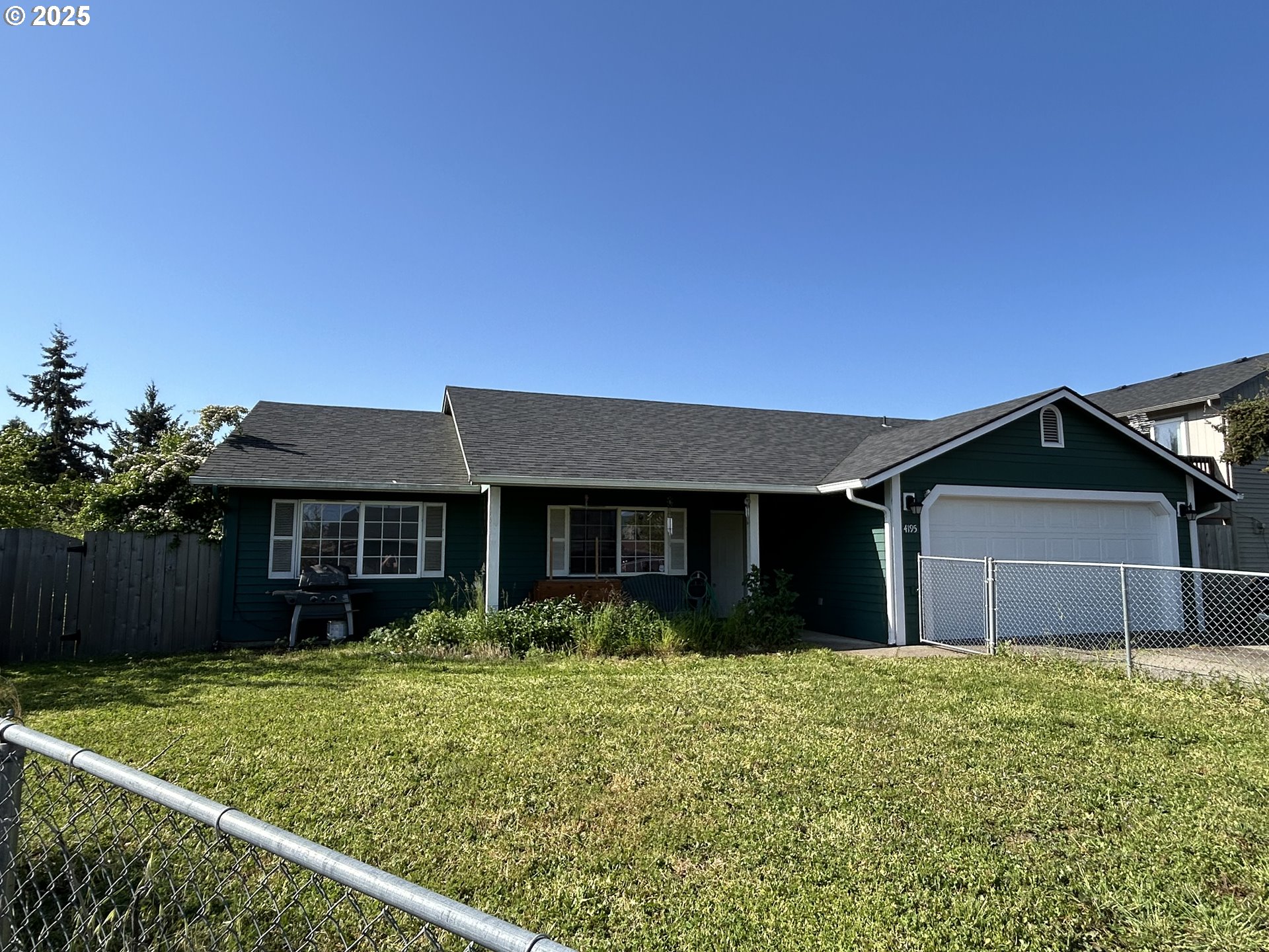 4195 Daisy Street Springfield, OR 97478 - Photo 1 of 20 front view of a house with a yard