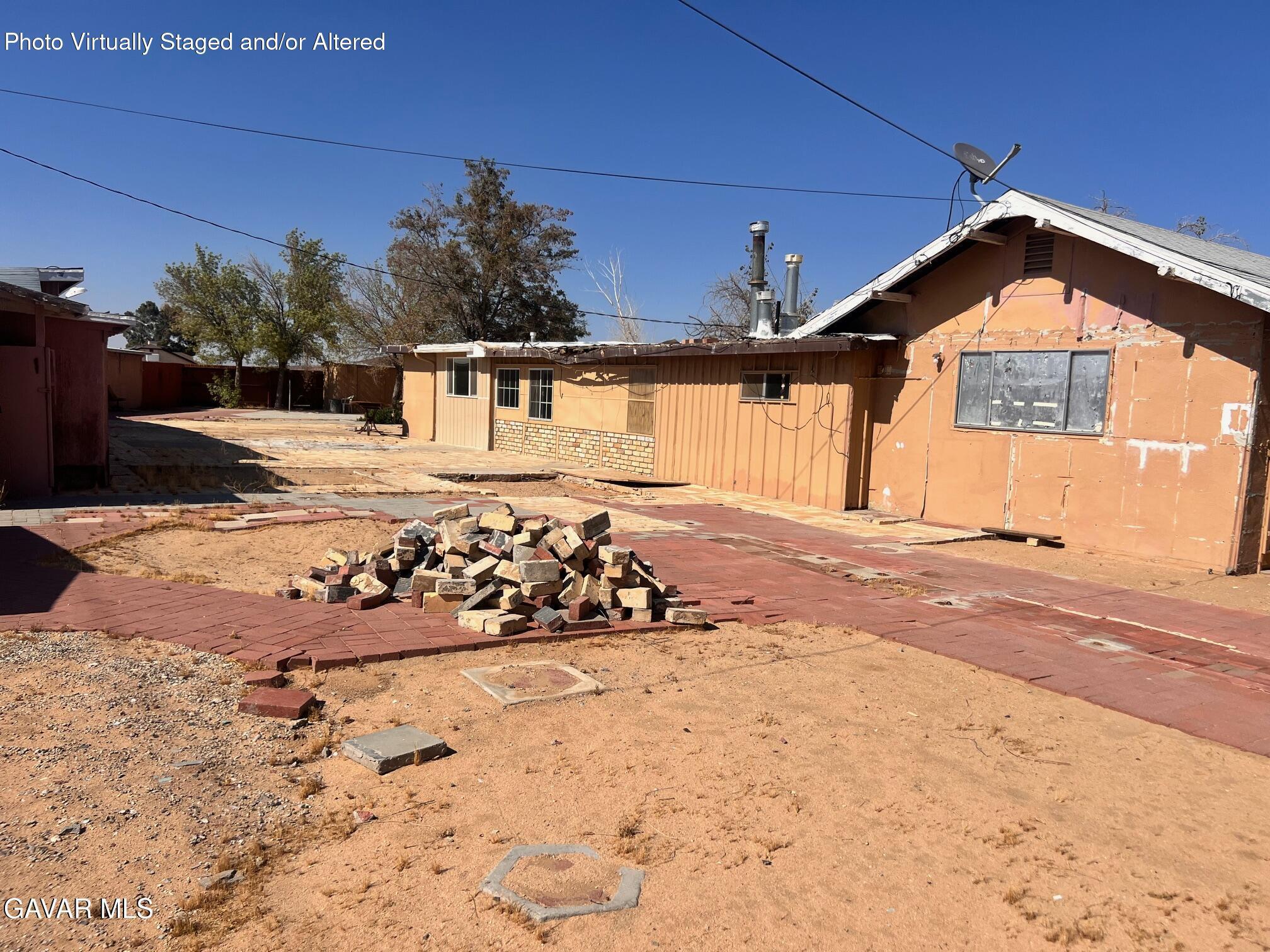 13227 Flint Street North Edwards, CA 93523 - Photo 23 of 84 a front view of a house with a yard