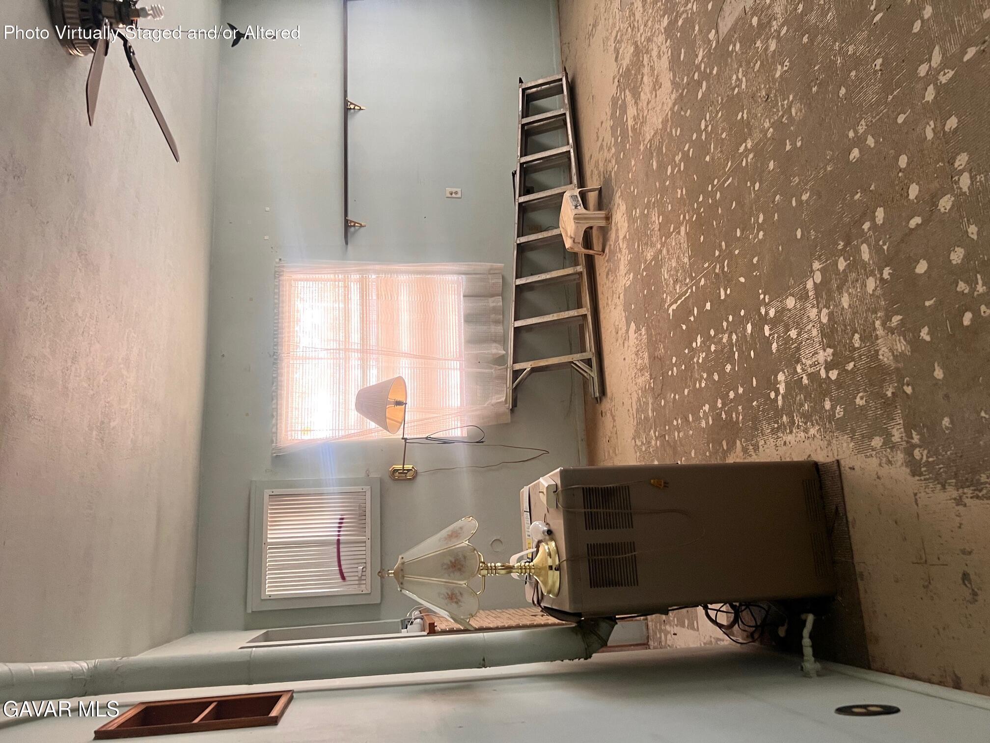 13227 Flint Street North Edwards, CA 93523 - Photo 78 of 84 a living room with couches and a potted plant next to a window