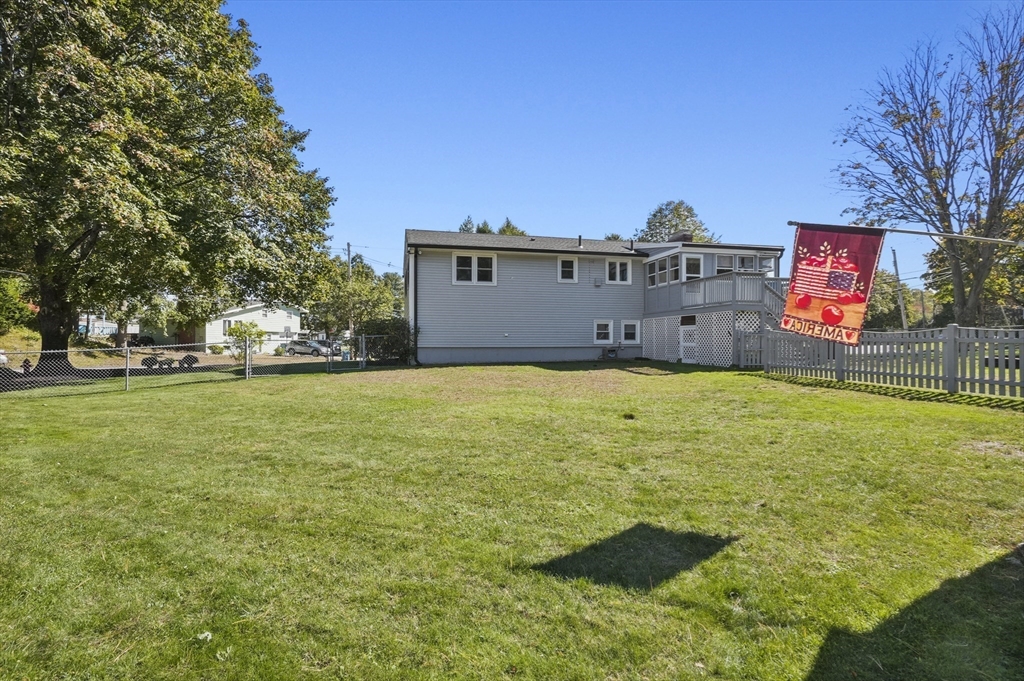 35 Blackman Road Canton, MA 02021 - Photo 19 of 26 a view of a big room with a big yard and large trees