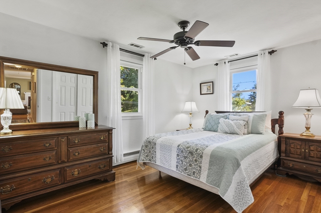 35 Blackman Road Canton, MA 02021 - Photo 10 of 26 a bedroom with a bed and wooden floor