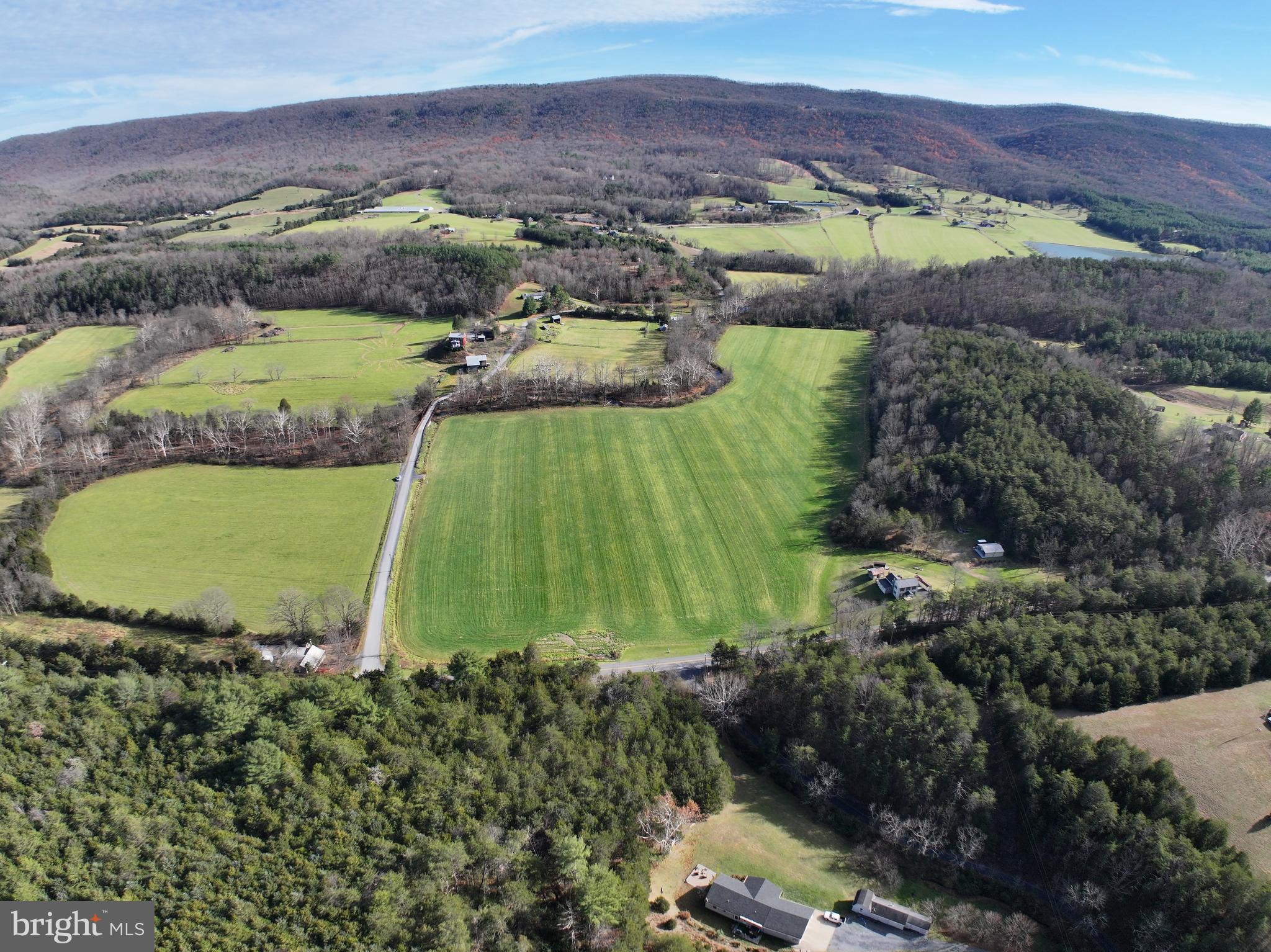 0 Fort Valley Road Fort Valley, VA 22652 - Photo 6 of 11 a view of a lush green hillside and houses