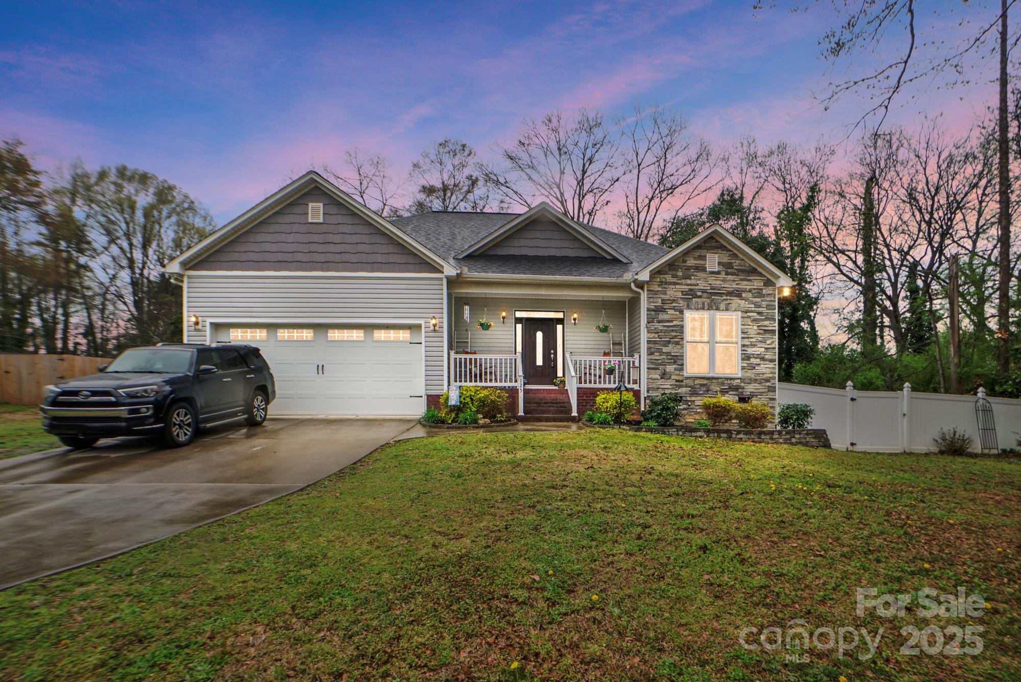 125 Jefferson Drive Locust, NC 28097 - Photo 1 of 27 a view of a house with a yard and sitting area
