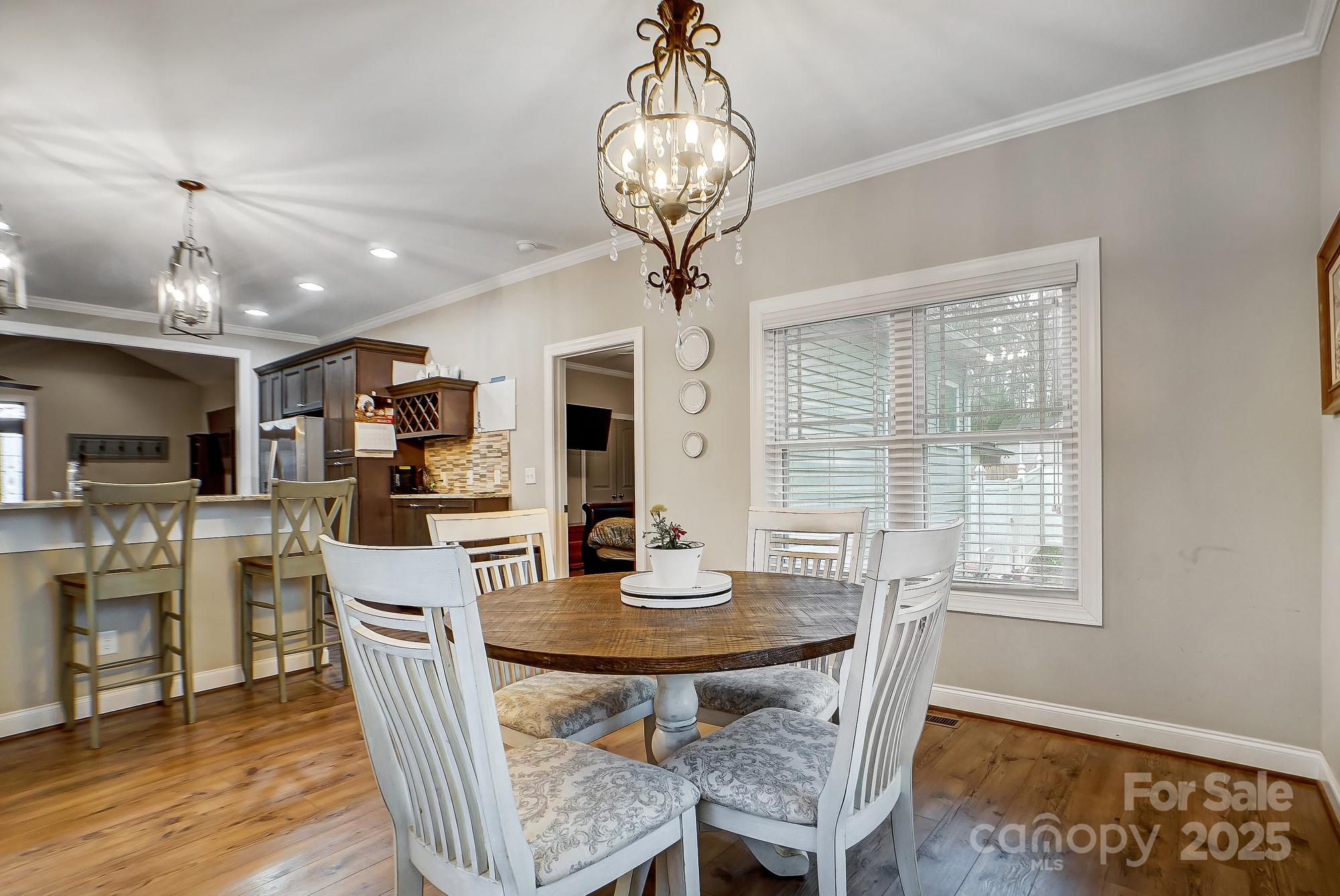 125 Jefferson Drive Locust, NC 28097 - Photo 15 of 27 a view of a dining room with furniture window and wooden floor