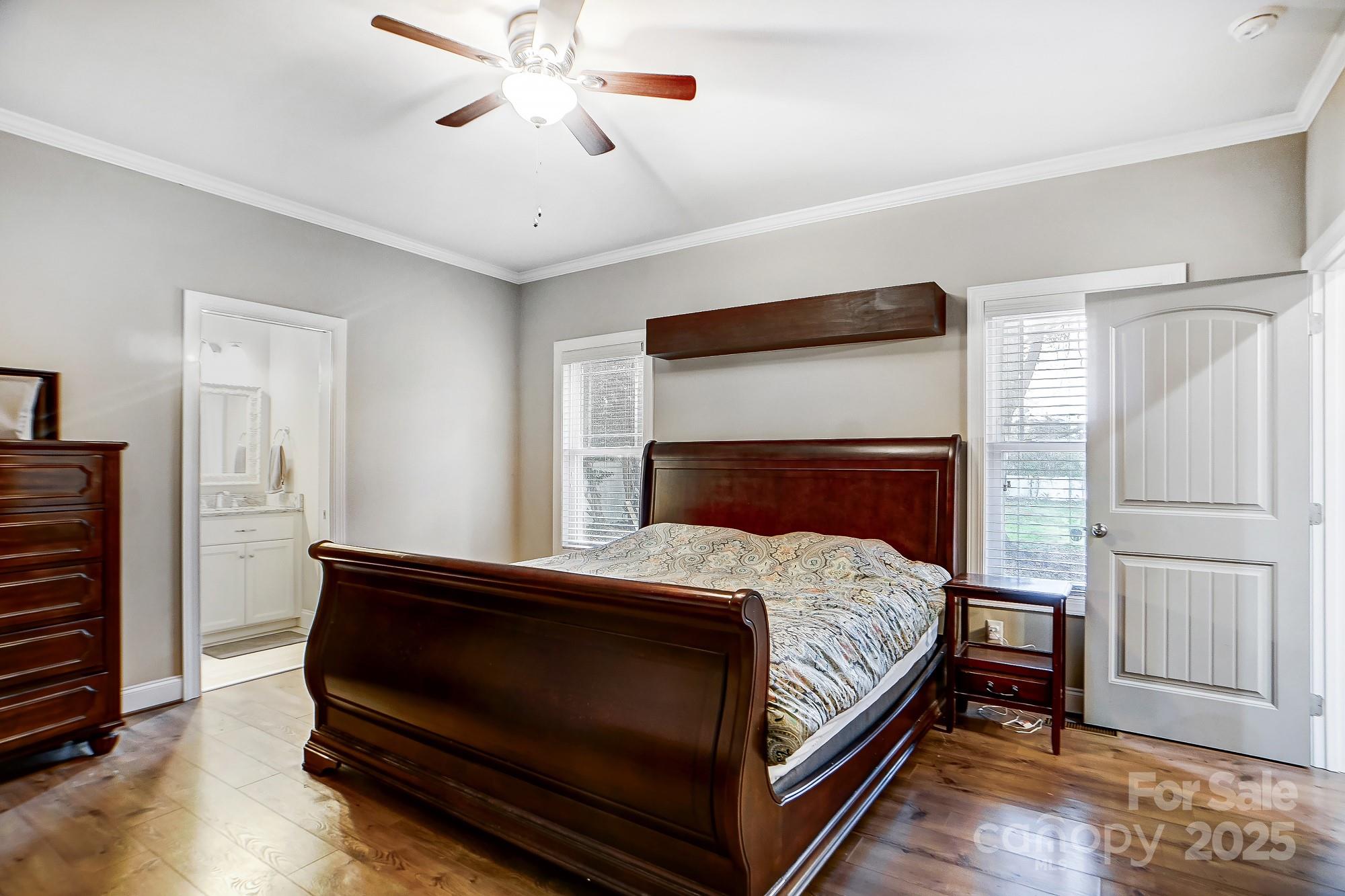125 Jefferson Drive Locust, NC 28097 - Photo 17 of 27 a bedroom with a bed and a chandelier