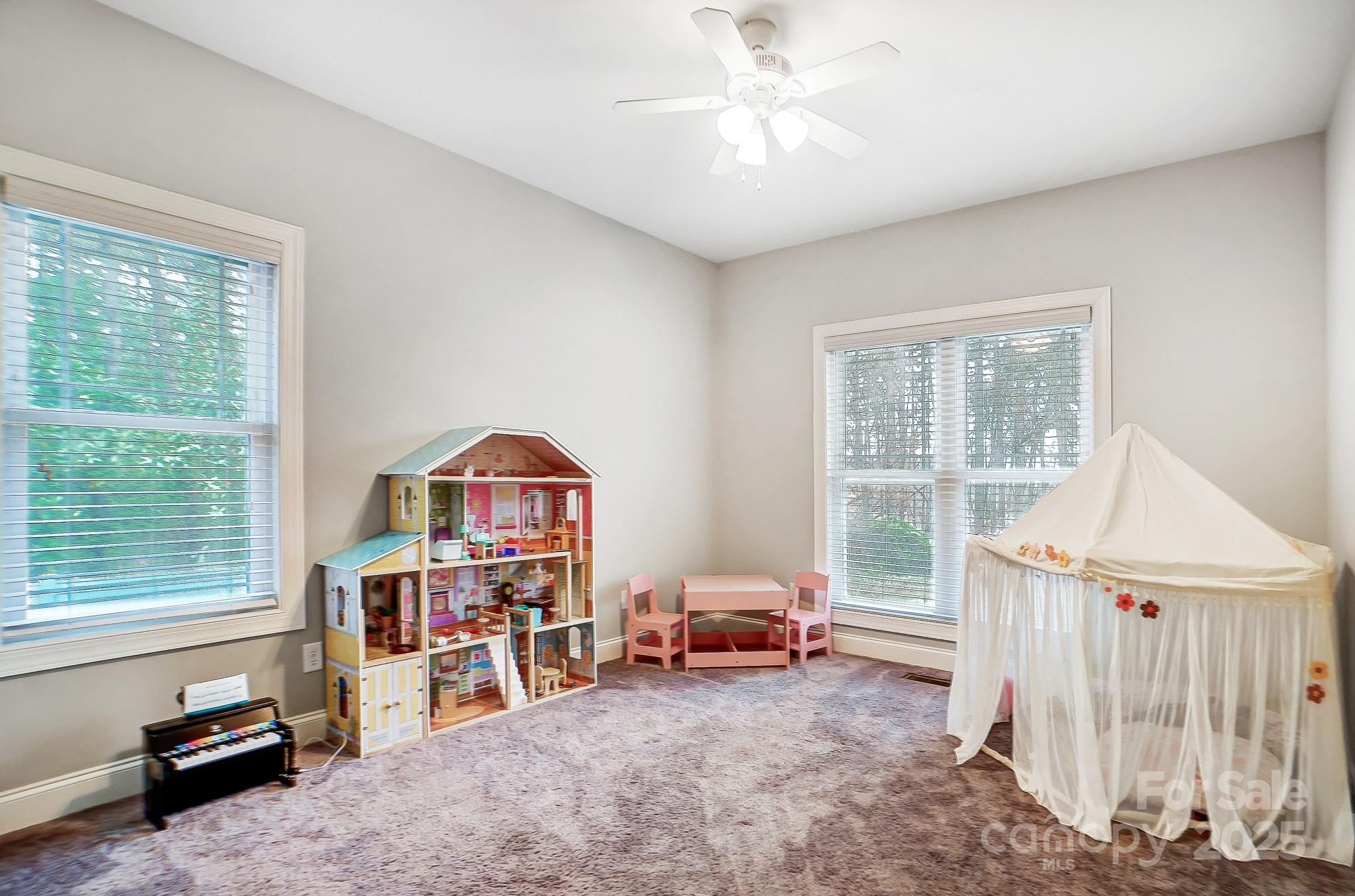 125 Jefferson Drive Locust, NC 28097 - Photo 20 of 27 a living room with furniture and a window