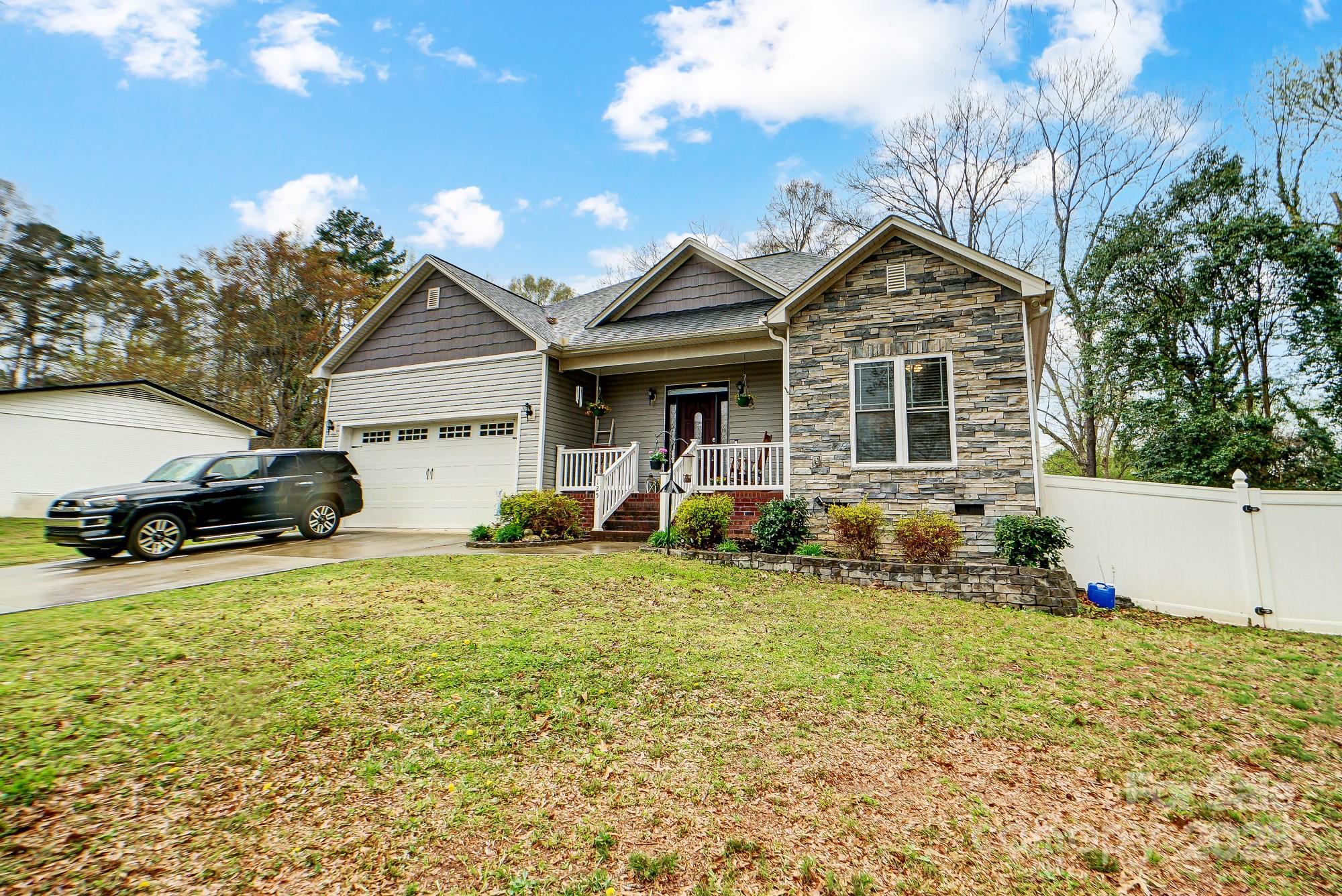 125 Jefferson Drive Locust, NC 28097 - Photo 3 of 27 a front view of a house with a yard