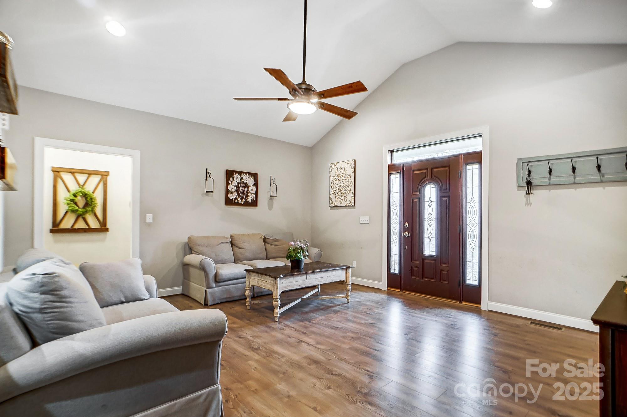 125 Jefferson Drive Locust, NC 28097 - Photo 6 of 27 a living room with furniture and a wooden floor