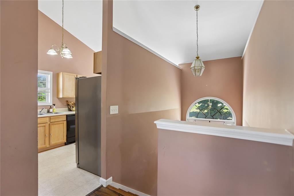 9720 Poole Road Villa Rica, GA 30180 - Photo 24 of 40 a kitchen with stainless steel appliances a refrigerator a sink a stove and a window